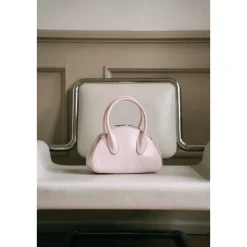 Lost In Echo Embossed Logo Leather Bowling Bag Pink